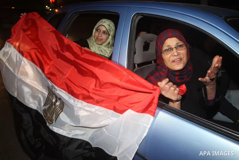 Palestinians celebrate the news of the resignation of President Hosni Mubarak, who handed control of the country to the military, at night in Gaza city, Friday, Feb. 11, 2011 Photo by Mohamed Asad
