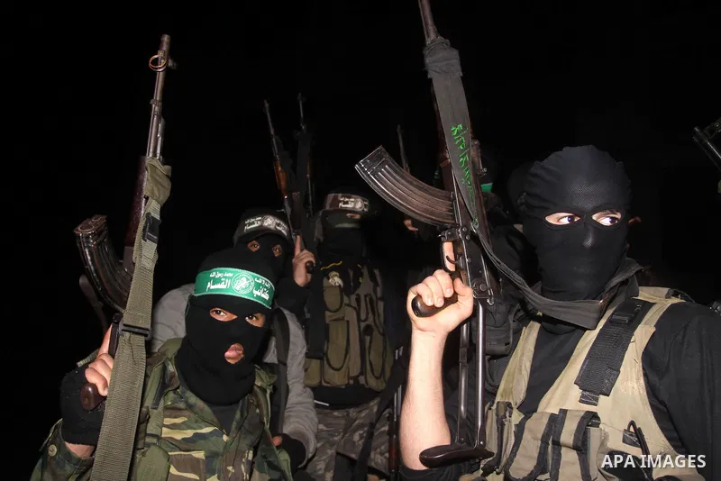 Palestinian Hamas militants march after receiving the news of Egyptian President Hosni Mubarak's resignation, as Hamas called for celebrations in Gaza City, Friday, Feb. 11, 2011. Egypt, along with Israel, had enforced a...
