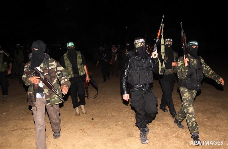 Palestinian Hamas militants march after receiving the news of Egyptian President Hosni Mubarak's resignation, as Hamas called for celebrations in Gaza City, Friday, Feb. 11, 2011. Egypt, along with Israel, had enforced a...