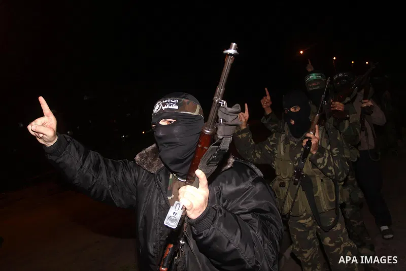 Palestinian Hamas militants march after receiving the news of Egyptian President Hosni Mubarak's resignation, as Hamas called for celebrations in Gaza City, Friday, Feb. 11, 2011. Egypt, along with Israel, had enforced a...