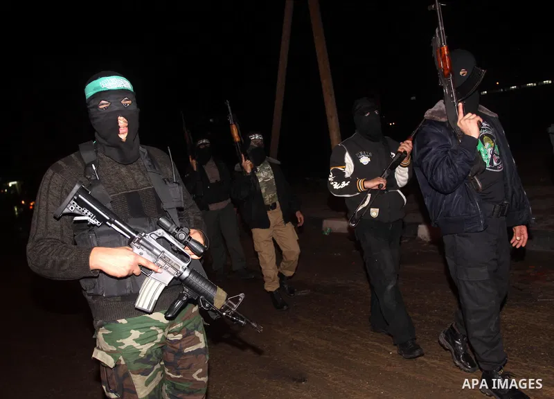 Palestinian Hamas militants march after receiving the news of Egyptian President Hosni Mubarak's resignation, as Hamas called for celebrations in Gaza City, Friday, Feb. 11, 2011. Egypt, along with Israel, had enforced a...