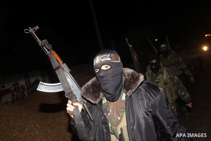 Palestinian Hamas militants march after receiving the news of Egyptian President Hosni Mubarak's resignation, as Hamas called for celebrations in Gaza City, Friday, Feb. 11, 2011. Egypt, along with Israel, had enforced a...