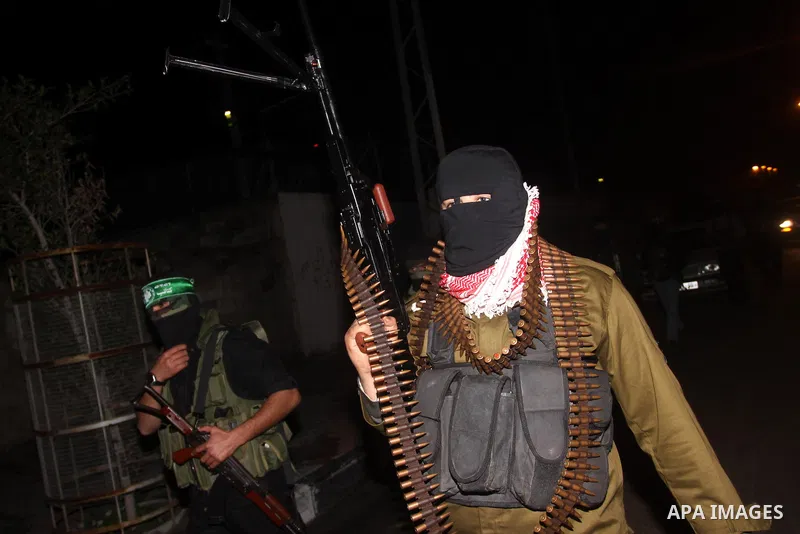 Palestinian Hamas militants march after receiving the news of Egyptian President Hosni Mubarak's resignation, as Hamas called for celebrations in Gaza City, Friday, Feb. 11, 2011. Egypt, along with Israel, had enforced a...