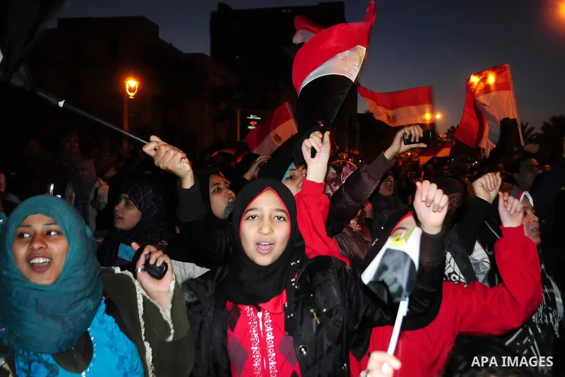 Egyptians celebrate the resignation of President Hosni Mubarak in Alexandria, Egypt, Feb. 11, 2011. Egypt's President Hosni Mubarak steps down and the military take charge of the country, Egypt's Vice President Omar Sule...