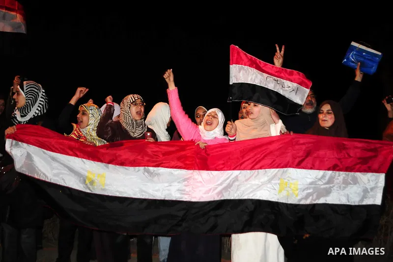 Egyptians celebrate the resignation of President Hosni Mubarak in Alexandria, Egypt, Feb. 11, 2011. Egypt's President Hosni Mubarak steps down and the military take charge of the country, Egypt's Vice President Omar Sule...