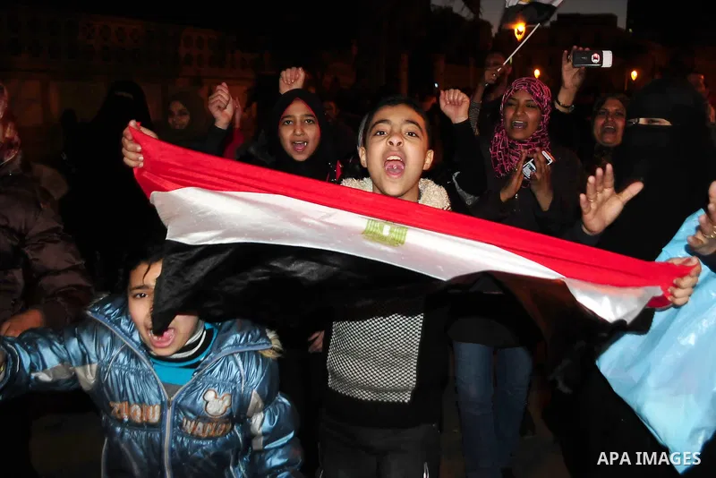 Egyptians celebrate the resignation of President Hosni Mubarak in Alexandria, Egypt, Feb. 11, 2011. Egypt's President Hosni Mubarak steps down and the military take charge of the country, Egypt's Vice President Omar Sule...
