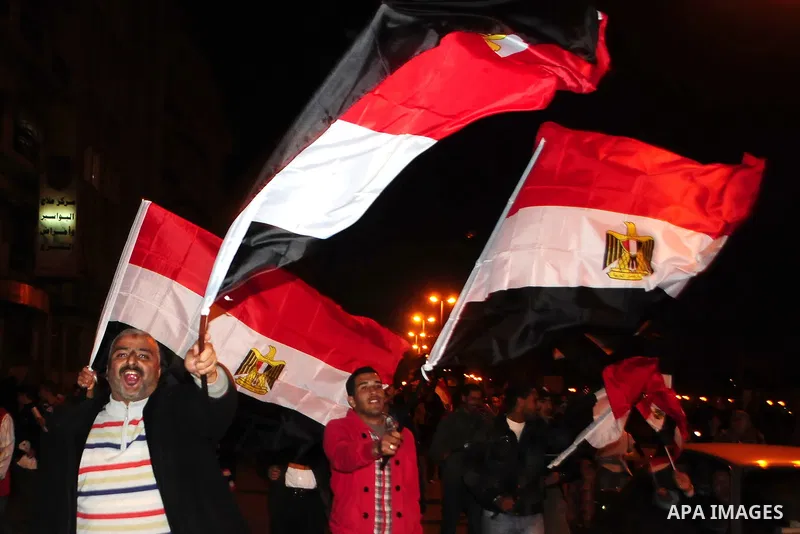 Egyptians celebrate the resignation of President Hosni Mubarak in Alexandria, Egypt, Feb. 11, 2011. Egypt's President Hosni Mubarak steps down and the military take charge of the country, Egypt's Vice President Omar Sule...