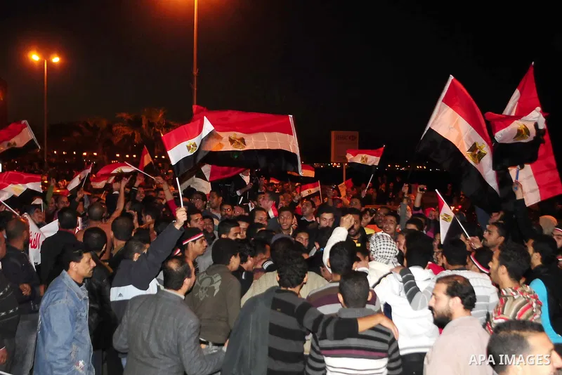 Egyptians celebrate the resignation of President Hosni Mubarak in Alexandria, Egypt, Feb. 11, 2011. Egypt's President Hosni Mubarak steps down and the military take charge of the country, Egypt's Vice President Omar Sule...