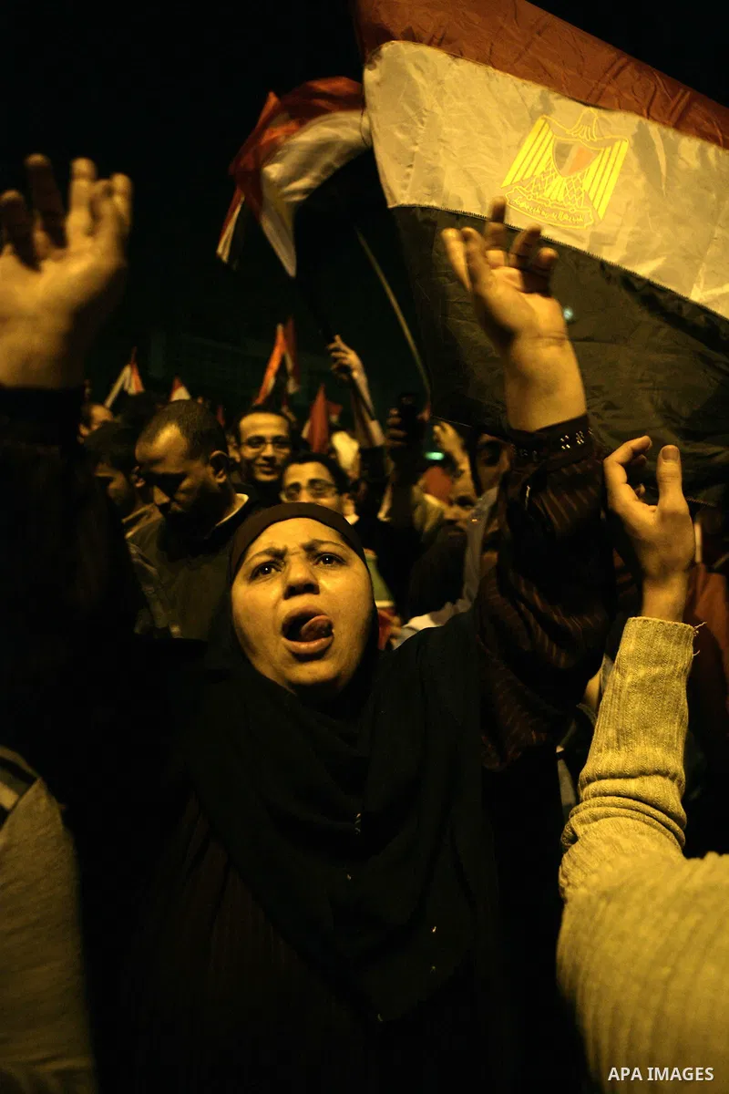 Egyptians celebrate the news of the resignation of President Hosni Mubarak, who handed control of the country to the military, at night in Tahrir Square in downtown Cairo, Egypt Friday, Feb. 11, 2011. Photo by Karam Nass...