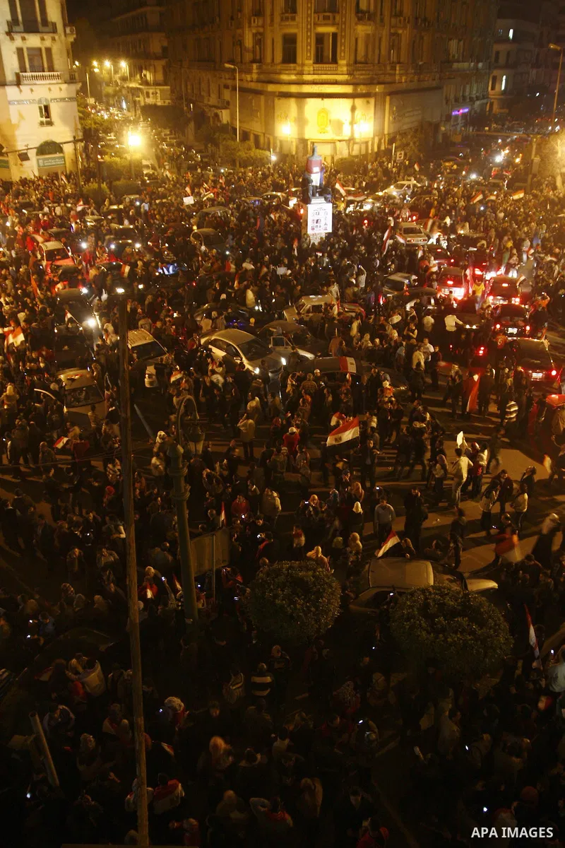 Egyptians celebrate the news of the resignation of President Hosni Mubarak, who handed control of the country to the military, at night in Tahrir Square in downtown Cairo, Egypt Friday, Feb. 11, 2011. Photo by Ahmed Asad