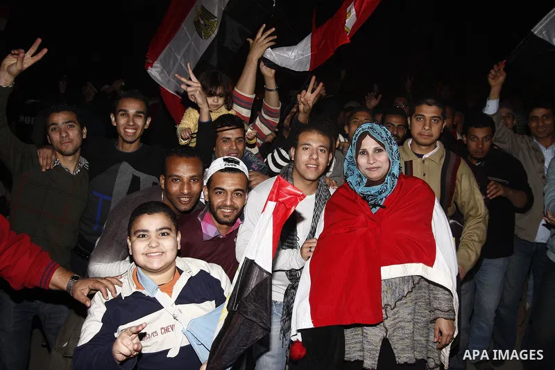 Egyptians celebrate the news of the resignation of President Hosni Mubarak, who handed control of the country to the military, at night in Tahrir Square in downtown Cairo, Egypt Friday, Feb. 11, 2011. Photo by Ahmed Asad