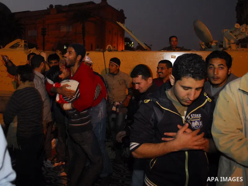 Egyptians celebrate the news of the resignation of President Hosni Mubarak, who handed control of the country to the military, at night in Tahrir Square in downtown Cairo, Egypt Friday, Feb. 11, 2011. Photo by Ahmed Asad
