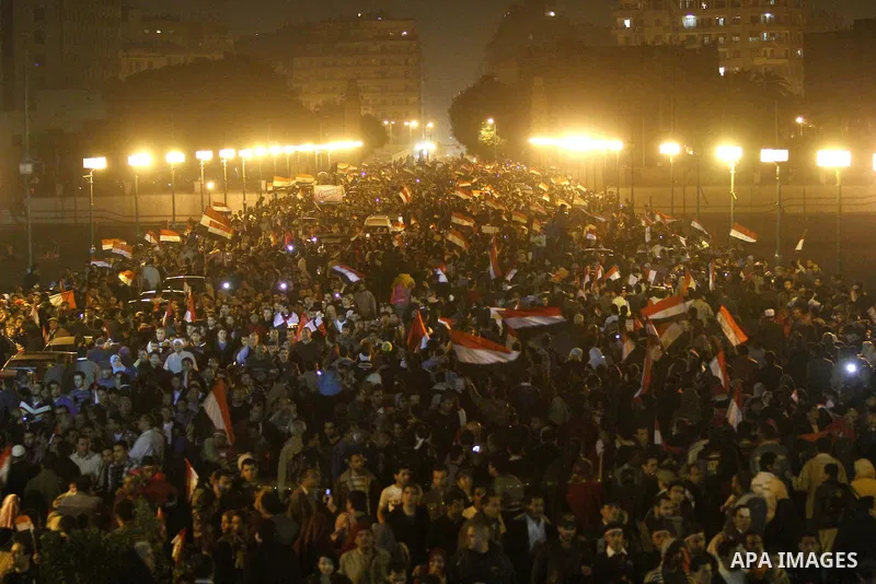 Egyptians celebrate the news of the resignation of President Hosni Mubarak, who handed control of the country to the military, at night in Tahrir Square in downtown Cairo, Egypt Friday, Feb. 11, 2011. Photo by Karam Nass...