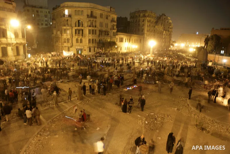 Egyptians celebrate the news of the resignation of President Hosni Mubarak, who handed control of the country to the military, at night in Tahrir Square in downtown Cairo, Egypt Friday, Feb. 11, 2011. Photo by Karam Nass...