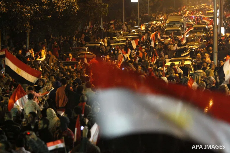 Egyptians celebrate the news of the resignation of President Hosni Mubarak, who handed control of the country to the military, at night in Tahrir Square in downtown Cairo, Egypt Friday, Feb. 11, 2011. Photo by Karam Nass...