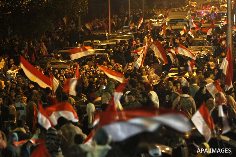 Egyptians celebrate the news of the resignation of President Hosni Mubarak, who handed control of the country to the military, at night in Tahrir Square in downtown Cairo, Egypt Friday, Feb. 11, 2011. Photo by Karam Nass...