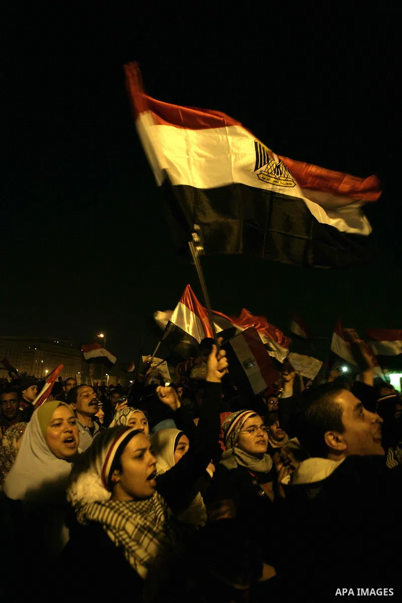 Egyptians celebrate the news of the resignation of President Hosni Mubarak, who handed control of the country to the military, at night in Tahrir Square in downtown Cairo, Egypt Friday, Feb. 11, 2011. Photo by Karam Nass...