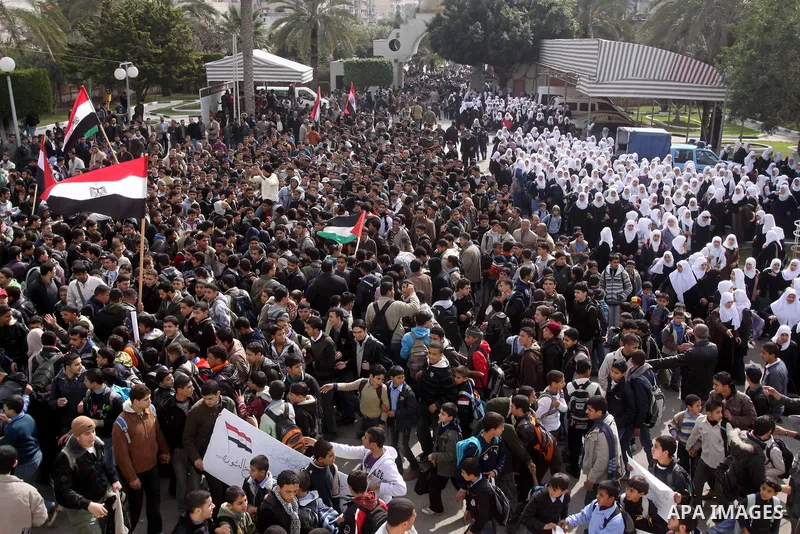 Palestinian students participate in a rally celebrating the resignation of Egyptian President Hosni Mubarak, in Gaza City, on Feb. 12, 2011. Photo by Mohammed Asad