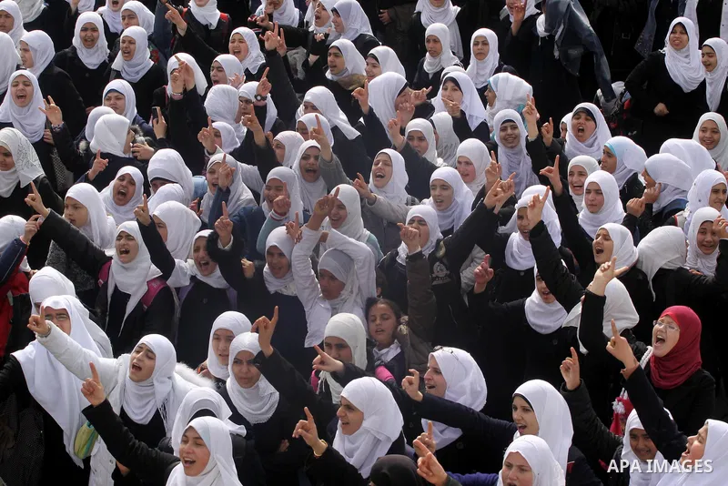 Palestinian students participate in a rally celebrating the resignation of Egyptian President Hosni Mubarak, in Gaza City, on Feb. 12, 2011. Photo by Mohammed Asad