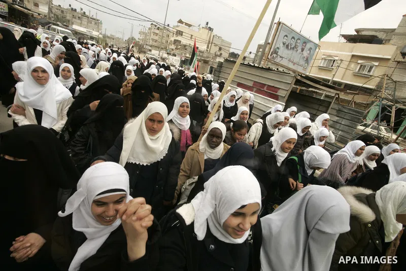 Palestinian students participate in a rally celebrating the resignation of Egyptian President Hosni Mubarak, in southern Gaza Strip town of Rafah on Feb. 12, 2011. Photo by Abed Rahim Khatib
