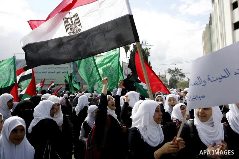 Palestinians celebrate Egyptian President Hosni Mubarak's resignation, in Gaza City, Saturday, Feb. 12 , 2011. Hamas leaders called on the new Egypt to open the borders with Gaza. "Egypt wrote today a new chapter in the...
