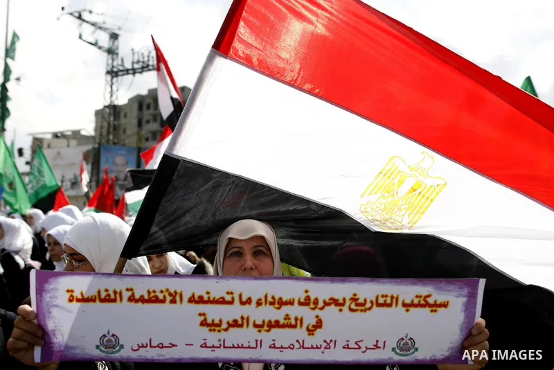 Palestinians celebrate Egyptian President Hosni Mubarak's resignation, in Gaza City, Saturday, Feb. 12 , 2011. Hamas leaders called on the new Egypt to open the borders with Gaza. "Egypt wrote today a new chapter in the...
