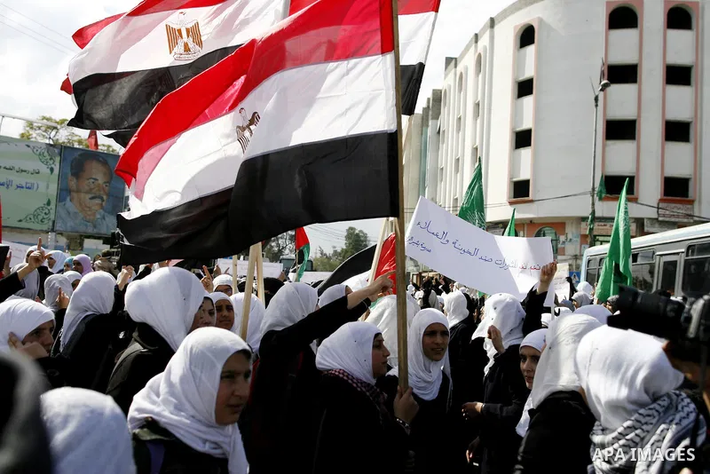 Palestinians celebrate Egyptian President Hosni Mubarak's resignation, in Gaza City, Saturday, Feb. 12 , 2011. Hamas leaders called on the new Egypt to open the borders with Gaza. "Egypt wrote today a new chapter in the...