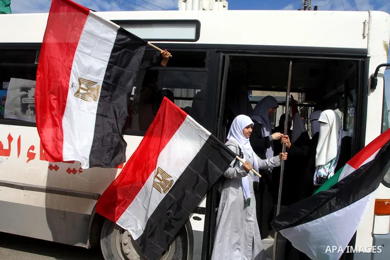 Palestinians celebrate Egyptian President Hosni Mubarak's resignation, in Gaza City, Saturday, Feb. 12 , 2011. Hamas leaders called on the new Egypt to open the borders with Gaza. "Egypt wrote today a new chapter in the...