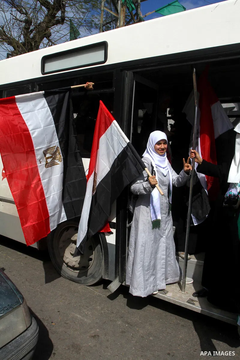 Palestinians celebrate Egyptian President Hosni Mubarak's resignation, in Gaza City, Saturday, Feb. 12 , 2011. Hamas leaders called on the new Egypt to open the borders with Gaza. "Egypt wrote today a new chapter in the...