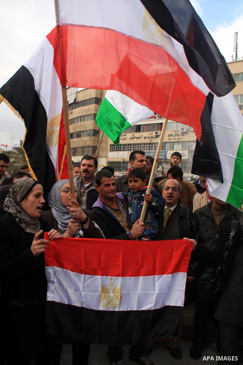 Palestinians celebrate Egyptian President Hosni Mubarak's resignation, in the West Bank city of Nablus, Saturday, Feb. 12 , 2011. Photo by Wagdi Eshtayah