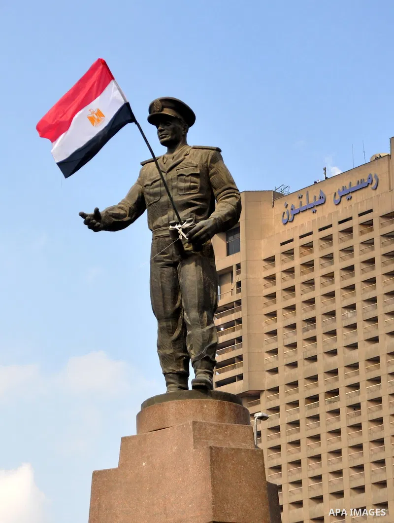 An Egyptian flag is seen on a statue of The Martyr General Abdel-Moneim Riad, one of the leaders of the Oct. 6 1973 war against Israel, near Tahrir Square, Saturday, Feb. 12, 2011. Egypt exploded with joy, tears, and rel...