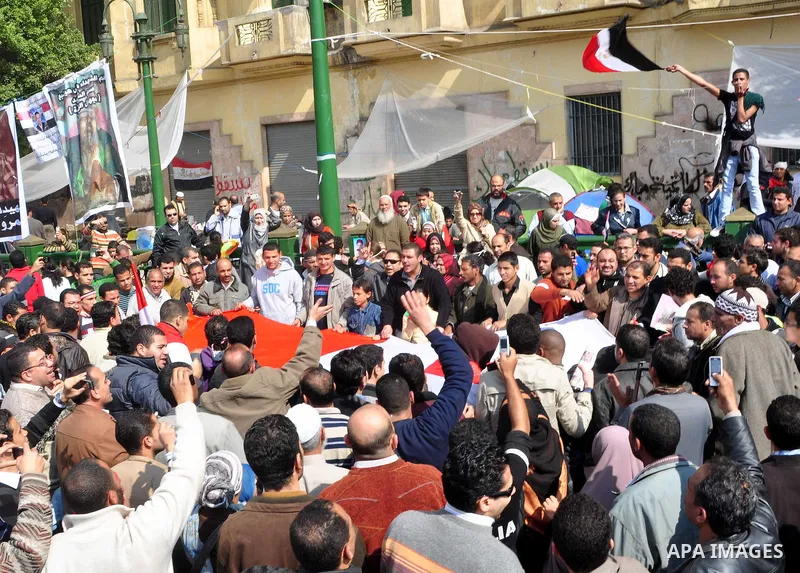 Egyptians celebrate and wave national flags in Tahrir Square in Cairo, Egypt, Saturday, Feb. 12, 2011. Egypt exploded with joy, tears, and relief after pro-democracy protesters brought down President Hosni Mubarak with a...