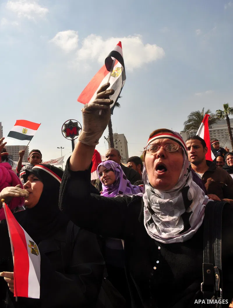 Egyptians celebrate and wave national flags in Tahrir Square in Cairo, Egypt, Saturday, Feb. 12, 2011. Egypt exploded with joy, tears, and relief after pro-democracy protesters brought down President Hosni Mubarak with a...