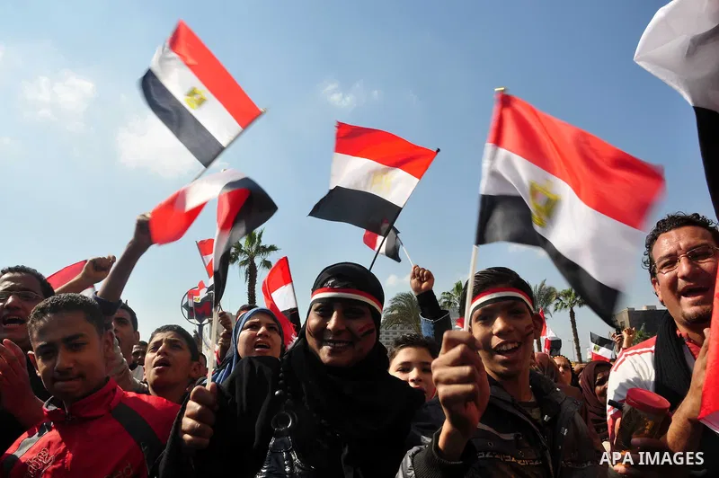 Egyptians celebrate and wave national flags in Tahrir Square in Cairo, Egypt, Saturday, Feb. 12, 2011. Egypt exploded with joy, tears, and relief after pro-democracy protesters brought down President Hosni Mubarak with a...