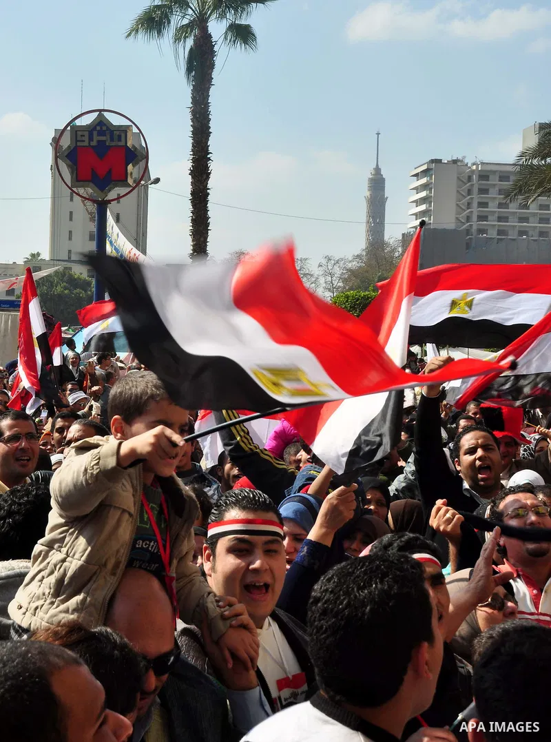 Egyptians celebrate and wave national flags in Tahrir Square in Cairo, Egypt, Saturday, Feb. 12, 2011. Egypt exploded with joy, tears, and relief after pro-democracy protesters brought down President Hosni Mubarak with a...