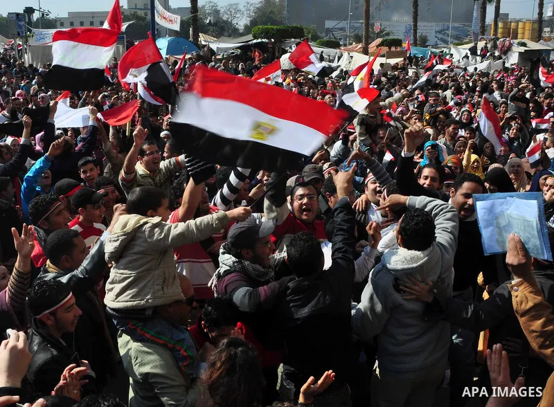 Egyptians celebrate and wave national flags in Tahrir Square in Cairo, Egypt, Saturday, Feb. 12, 2011. Egypt exploded with joy, tears, and relief after pro-democracy protesters brought down President Hosni Mubarak with a...