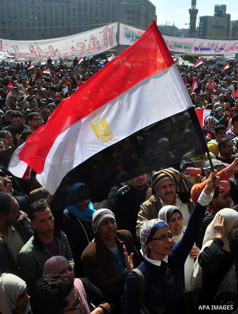 Egyptians celebrate and wave national flags in Tahrir Square in Cairo, Egypt, Saturday, Feb. 12, 2011. Egypt exploded with joy, tears, and relief after pro-democracy protesters brought down President Hosni Mubarak with a...