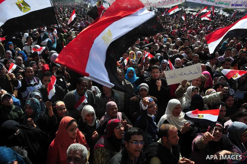 Egyptians celebrate and wave national flags in Tahrir Square in Cairo, Egypt, Saturday, Feb. 12, 2011. Egypt exploded with joy, tears, and relief after pro-democracy protesters brought down President Hosni Mubarak with a...