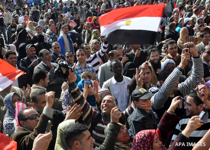 Egyptians celebrate and wave national flags in Tahrir Square in Cairo, Egypt, Saturday, Feb. 12, 2011. Egypt exploded with joy, tears, and relief after pro-democracy protesters brought down President Hosni Mubarak with a...