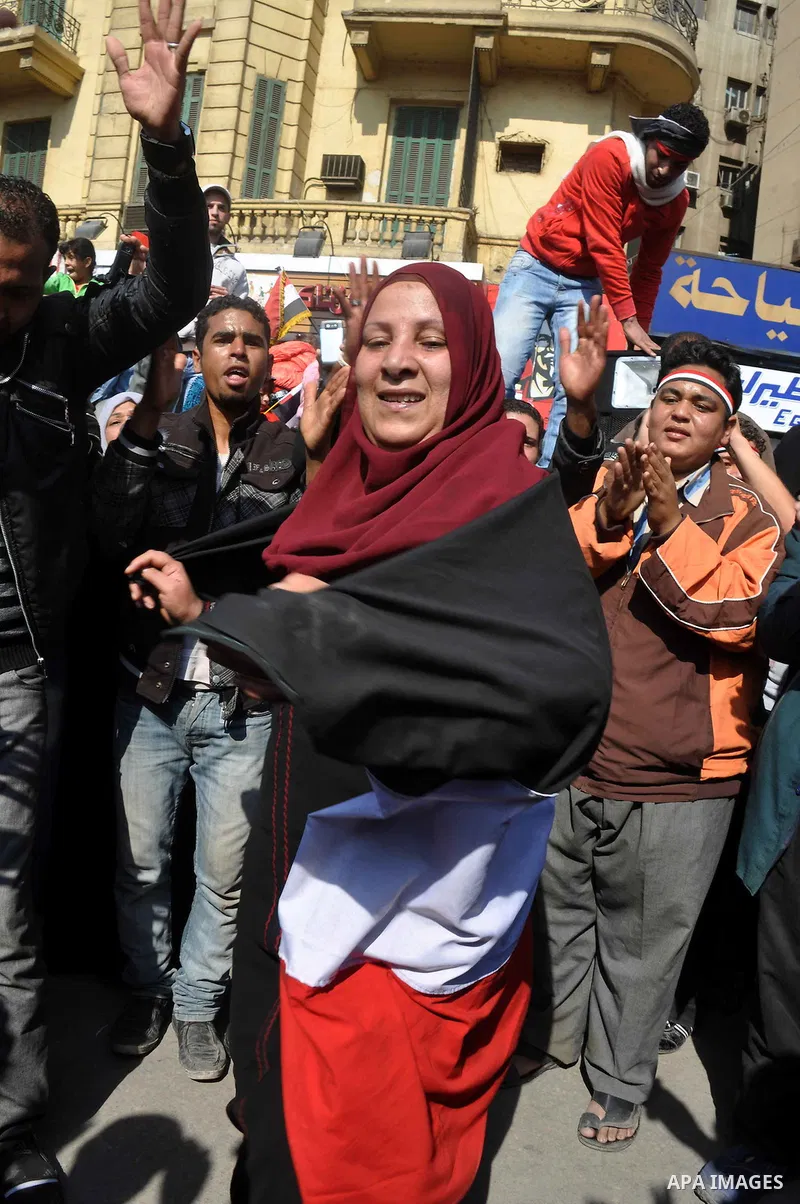 Egyptians celebrate and wave national flags in Tahrir Square in Cairo, Egypt, Saturday, Feb. 12, 2011. Egypt exploded with joy, tears, and relief after pro-democracy protesters brought down President Hosni Mubarak with a...