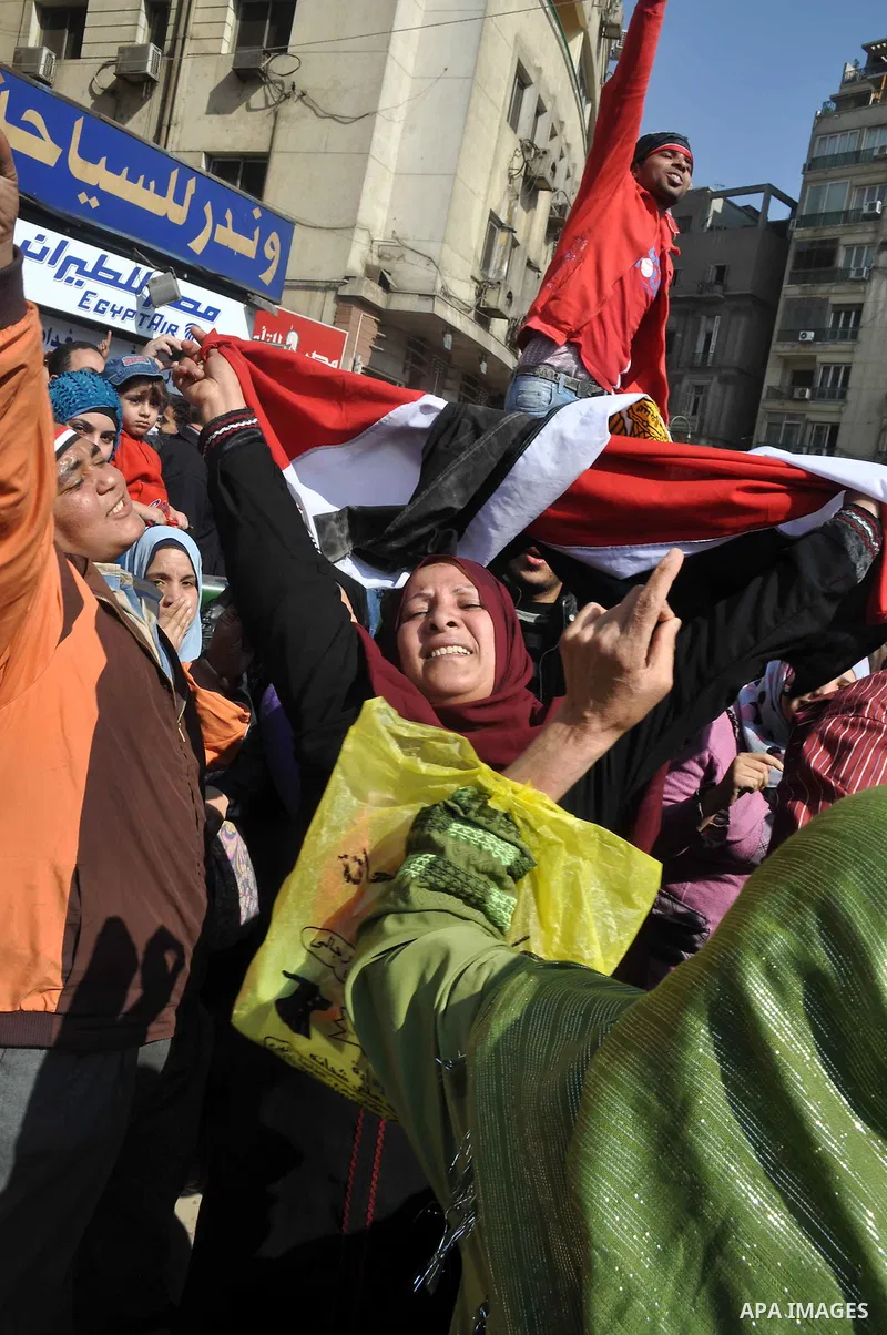 Egyptians celebrate and wave national flags in Tahrir Square in Cairo, Egypt, Saturday, Feb. 12, 2011. Egypt exploded with joy, tears, and relief after pro-democracy protesters brought down President Hosni Mubarak with a...