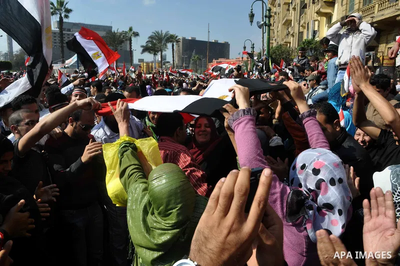 Egyptians celebrate and wave national flags in Tahrir Square in Cairo, Egypt, Saturday, Feb. 12, 2011. Egypt exploded with joy, tears, and relief after pro-democracy protesters brought down President Hosni Mubarak with a...