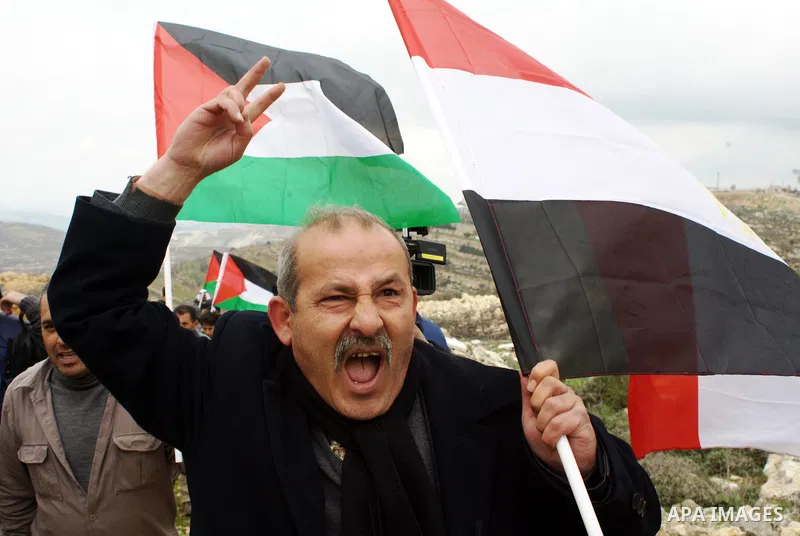 A Palestinian demonstrator argues with an Israeli soldier during a protest against Israel's controversial separation barrier organized by Palestinian and foreign peace activists in the West Bank village of Beit Omar, nea...