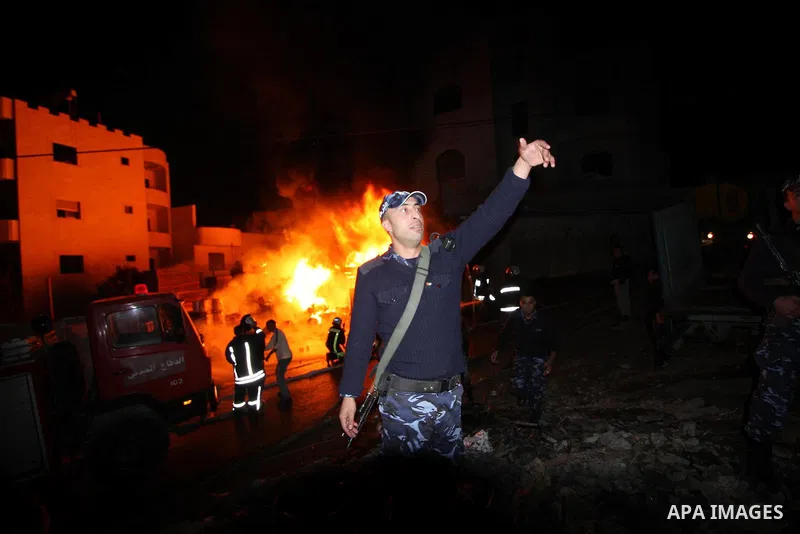 Palestinian civil defense forces try to stop fire burning in carpentry workshop and a factory for plastic materials, in the area of Doha, in Bethlehem on February 12, 2011. Photo by Najeh Hashlamoun