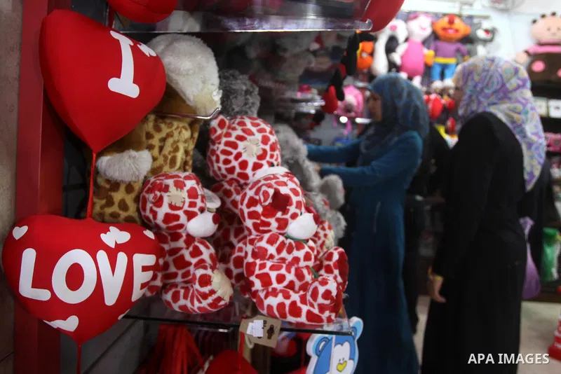 Palestinian girls buy a gift for Valentine's Day at a shop in Gaza City on February 13, 2010. Valentine's Day marks a Christian holiday on Feb, 14. Photo by Mohammed Asad