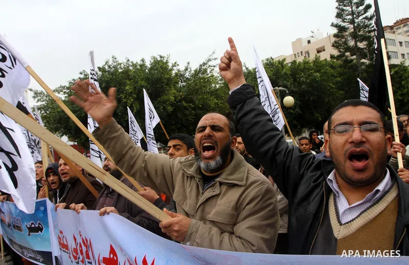 Palestinian supporters of the Al-Tahrir Islamic party shout slogans in support of the protesters in Egypt who forced their President Hosni Mubarak to resign, as they march in a rally in Gaza City on February 13, 2011. Ph...