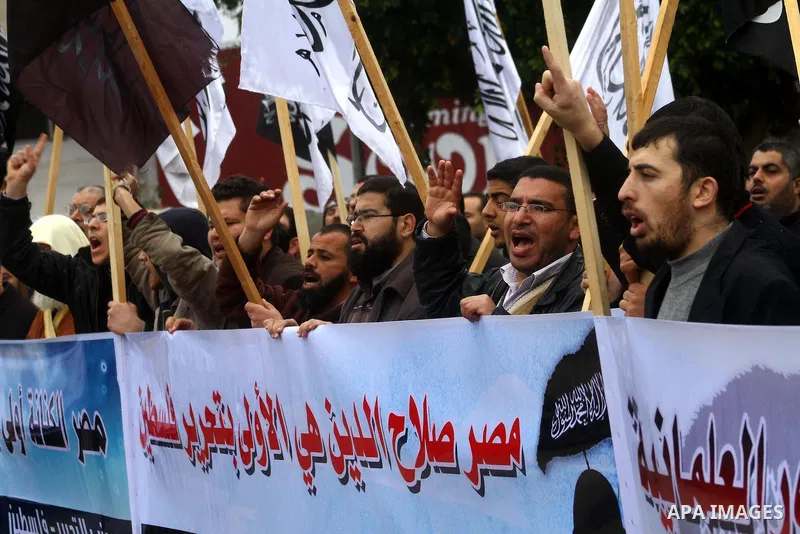 Palestinian supporters of the Al-Tahrir Islamic party shout slogans in support of the protesters in Egypt who forced their President Hosni Mubarak to resign, as they march in a rally in Gaza City on February 13, 2011. Ph...