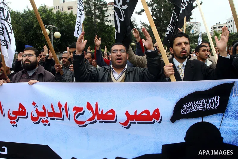 Palestinian supporters of the Al-Tahrir Islamic party shout slogans in support of the protesters in Egypt who forced their President Hosni Mubarak to resign, as they march in a rally in Gaza City on February 13, 2011. Ph...