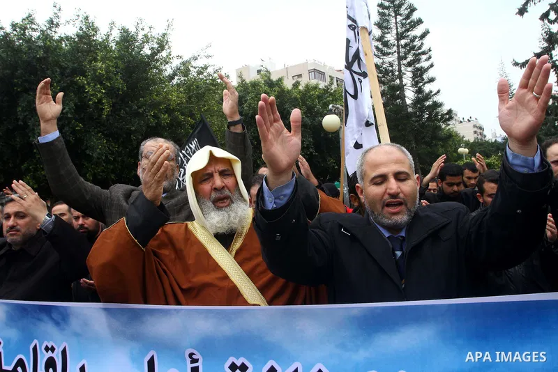 Palestinian supporters of the Al-Tahrir Islamic party shout slogans in support of the protesters in Egypt who forced their President Hosni Mubarak to resign, as they march in a rally in Gaza City on February 13, 2011. Ph...