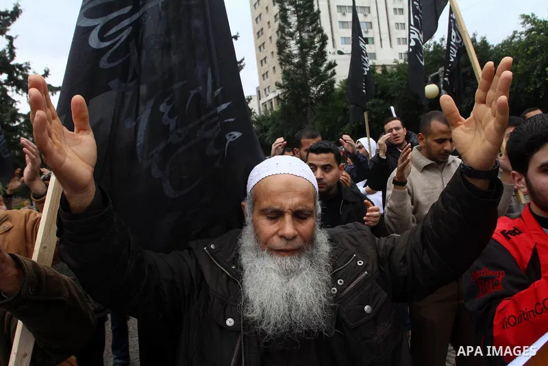 Palestinian supporters of the Al-Tahrir Islamic party shout slogans in support of the protesters in Egypt who forced their President Hosni Mubarak to resign, as they march in a rally in Gaza City on February 13, 2011. Ph...